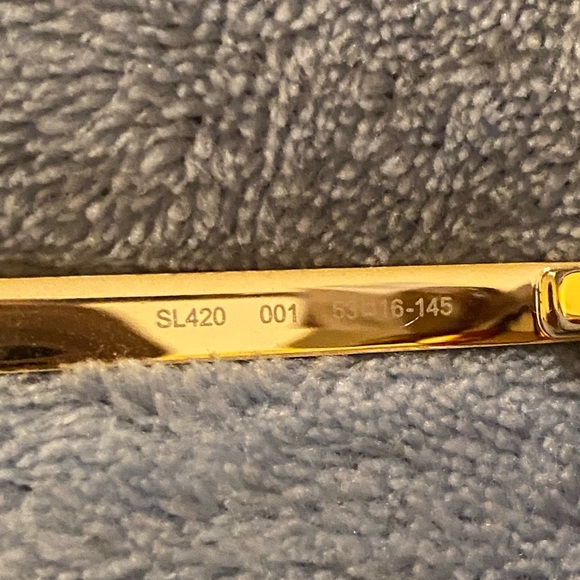 Yves St. Laurent sunglasses and Mui Mui case holder - Picture 10 of 11